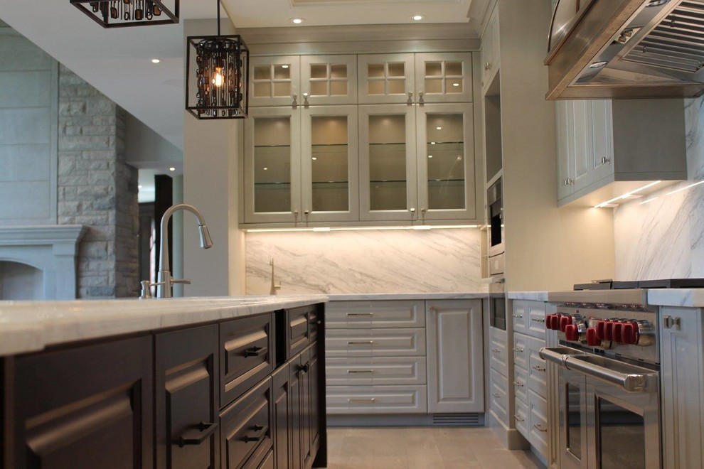Example of a transitional kitchen design in Calgary