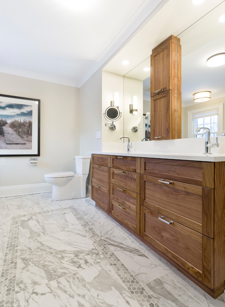 Photo of a large arts and crafts master bathroom in Other with shaker cabinets, medium wood cabinets, a freestanding tub, a double shower, a two-piece toilet, beige walls, ceramic floors, an undermount sink, engineered quartz benchtops, grey floor and a hinged shower door.