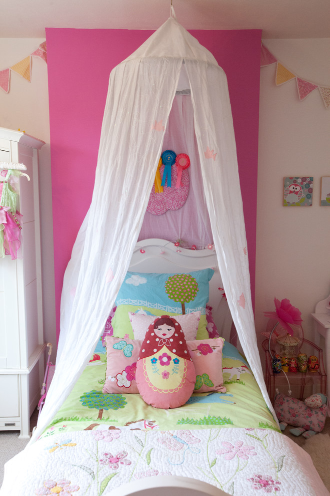 Photo of a small eclectic kids' room in Berkshire with white walls and carpet.