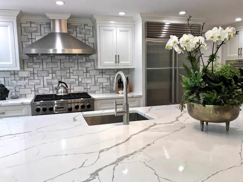 Example of a large transitional eat-in kitchen design in New York with beaded inset cabinets, gray cabinets, quartz countertops and an island
