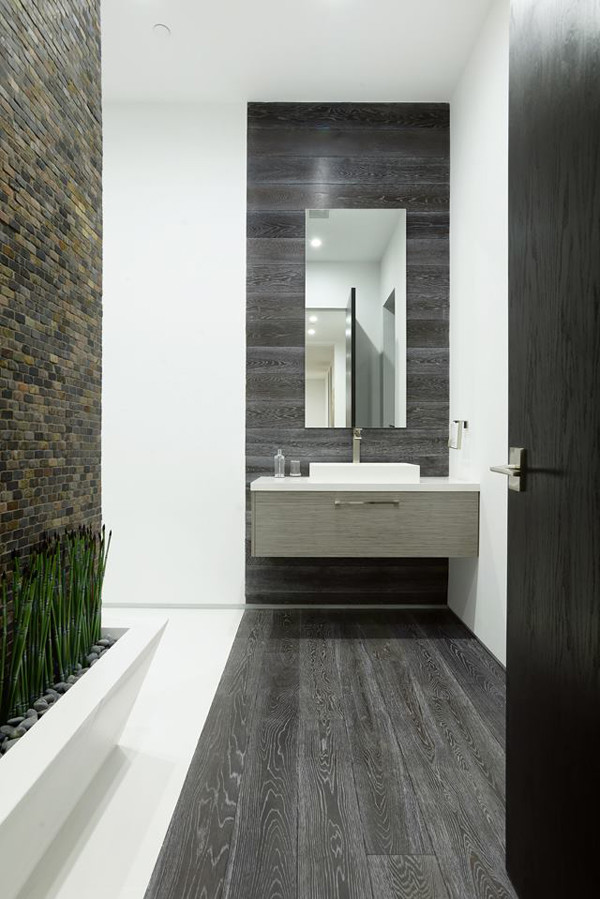 Design ideas for a large modern master bathroom in Los Angeles with flat-panel cabinets, white cabinets, a corner tub, an open shower, a one-piece toilet, white tile, stone tile, white walls, light hardwood floors, a pedestal sink and soapstone benchtops.