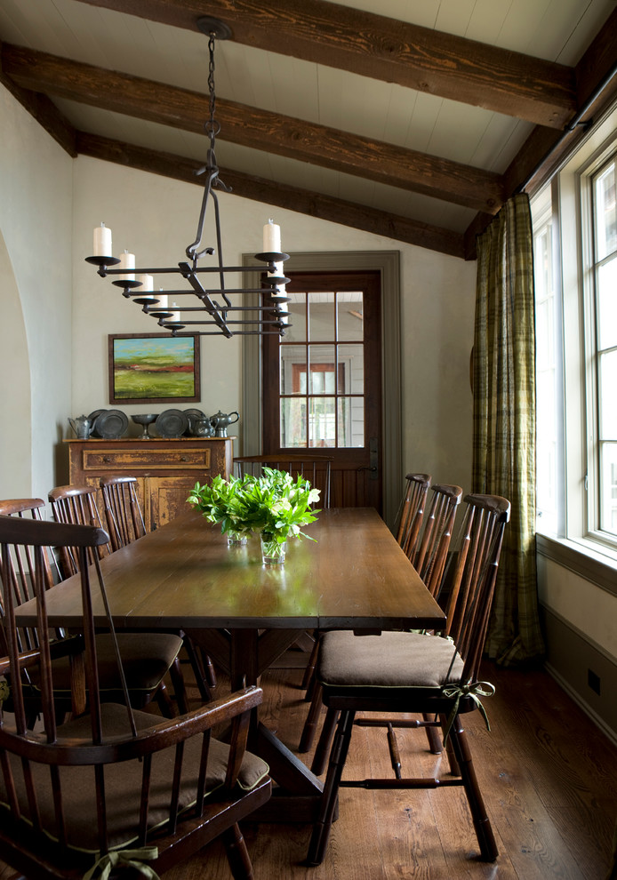 Country dining room in Atlanta with grey walls, dark hardwood floors and brown floor.