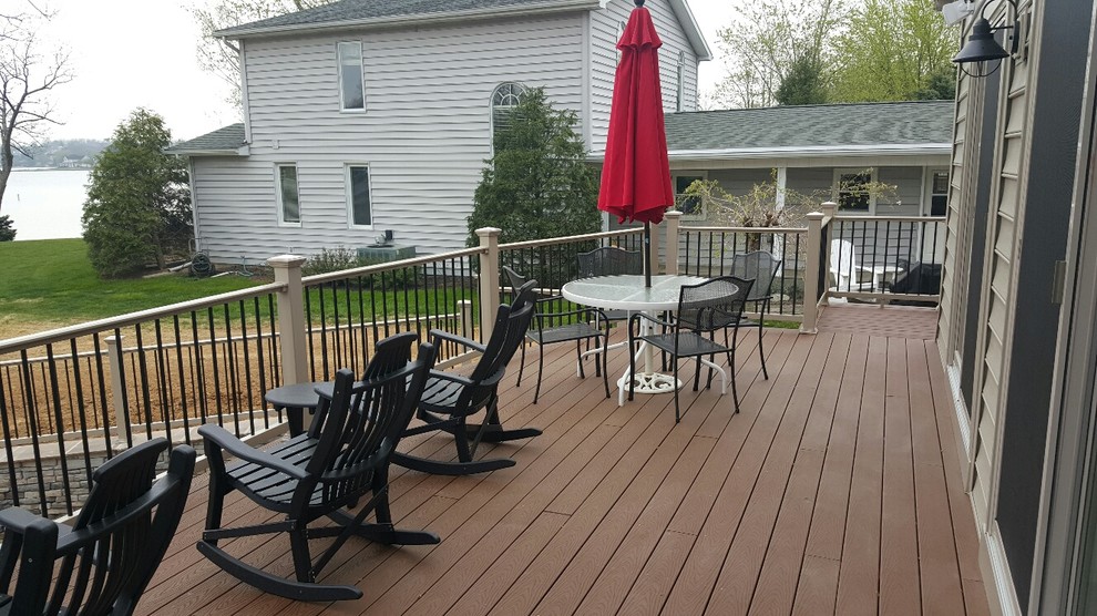 Inspiration for a large modern backyard deck remodel with no cover