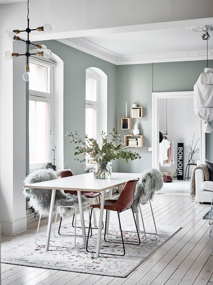 Design ideas for a mid-sized scandinavian dining room in Gothenburg with green walls.