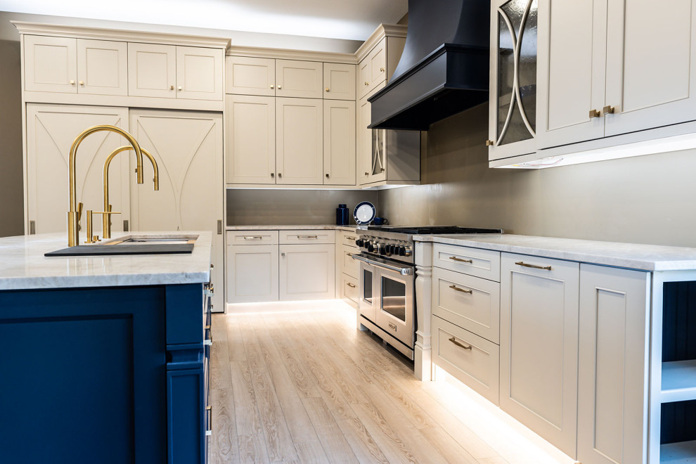 Medium sized classic l-shaped kitchen pantry in Other with a single-bowl sink, recessed-panel cabinets, white cabinets, quartz worktops, white splashback, ceramic splashback, stainless steel appliances, vinyl flooring, an island, beige floors and white worktops.