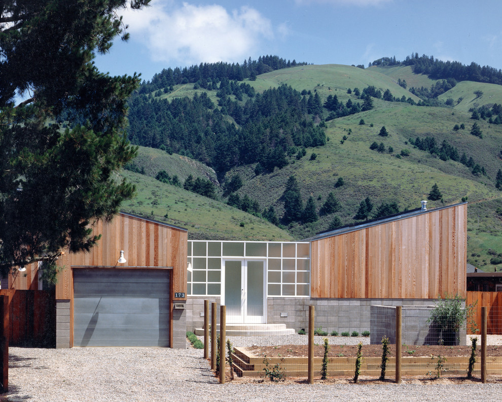Photo of a contemporary exterior in San Francisco with wood siding and a butterfly roof.