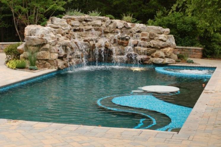 Example of a mid-sized transitional backyard brick and custom-shaped natural pool fountain design in Baltimore
