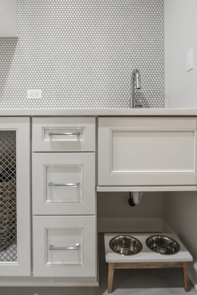 Design ideas for a small country single-wall utility room in Chicago with a single-bowl sink, shaker cabinets, white cabinets, quartz benchtops, grey walls, porcelain floors, a side-by-side washer and dryer, grey floor and white benchtop.