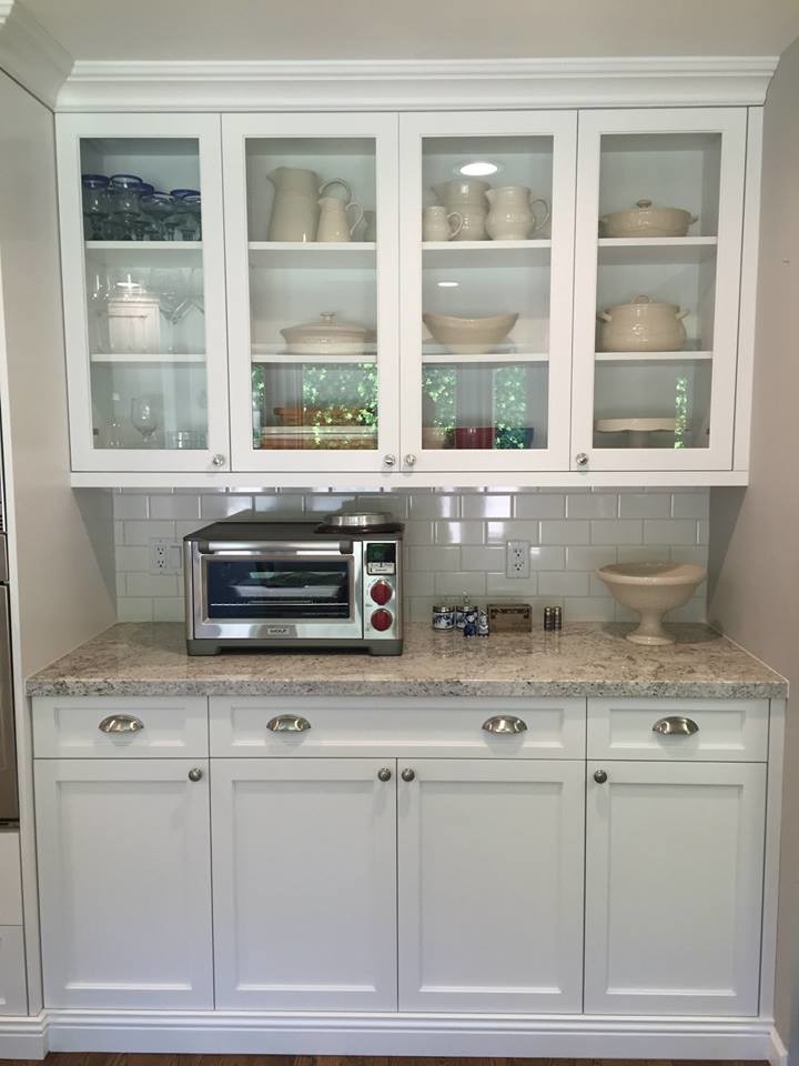 Example of a large transitional medium tone wood floor kitchen design in Phoenix with an undermount sink, shaker cabinets, white cabinets, granite countertops, white backsplash, subway tile backsplash, stainless steel appliances and an island