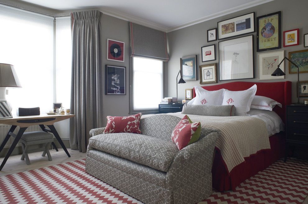 Inspiration for a transitional master bedroom in London with grey walls.