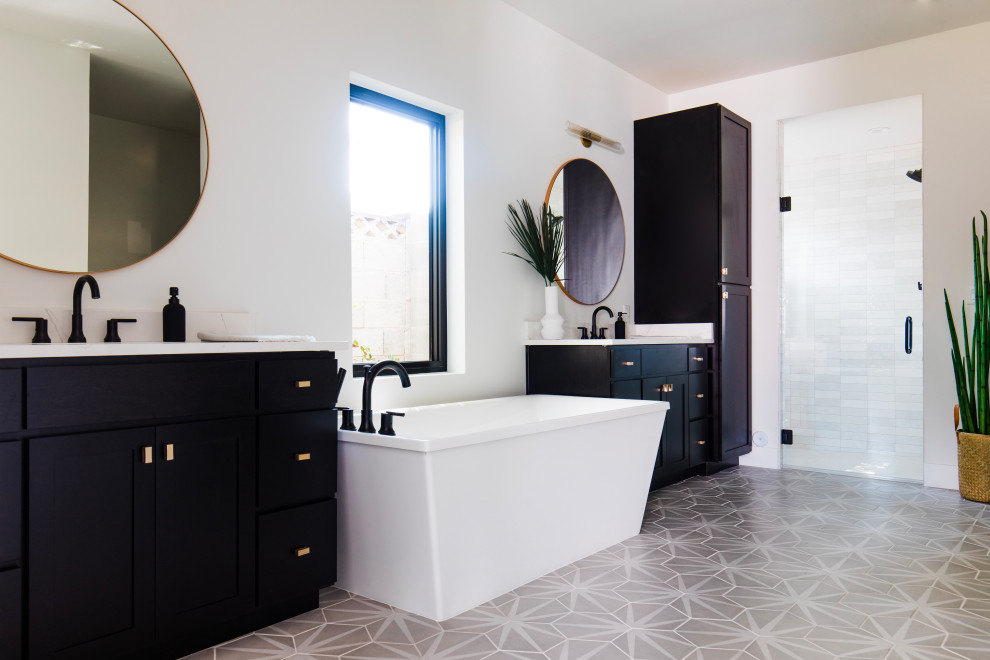 Large transitional master white tile and ceramic tile ceramic tile, gray floor and double-sink freestanding bathtub photo in Phoenix with shaker cabinets, black cabinets, quartz countertops, white countertops and a built-in vanity
