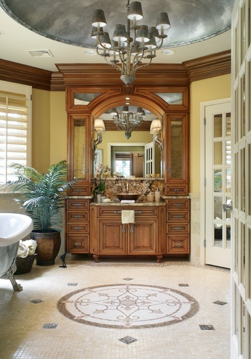 Design ideas for a traditional master bathroom in New York with recessed-panel cabinets, medium wood cabinets, a freestanding tub, a corner shower, a two-piece toilet, yellow tile, mosaic tile, yellow walls, mosaic tile floors, a vessel sink and granite benchtops.