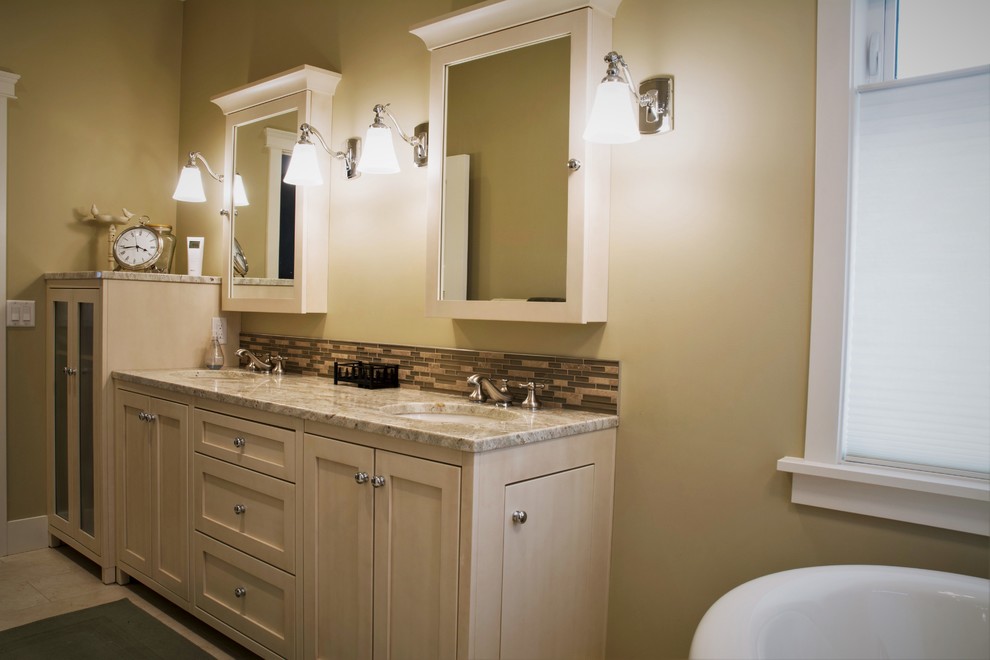 Example of a mid-sized transitional master ceramic tile alcove shower design in Calgary with beige cabinets, beige walls, granite countertops, an undermount sink and shaker cabinets