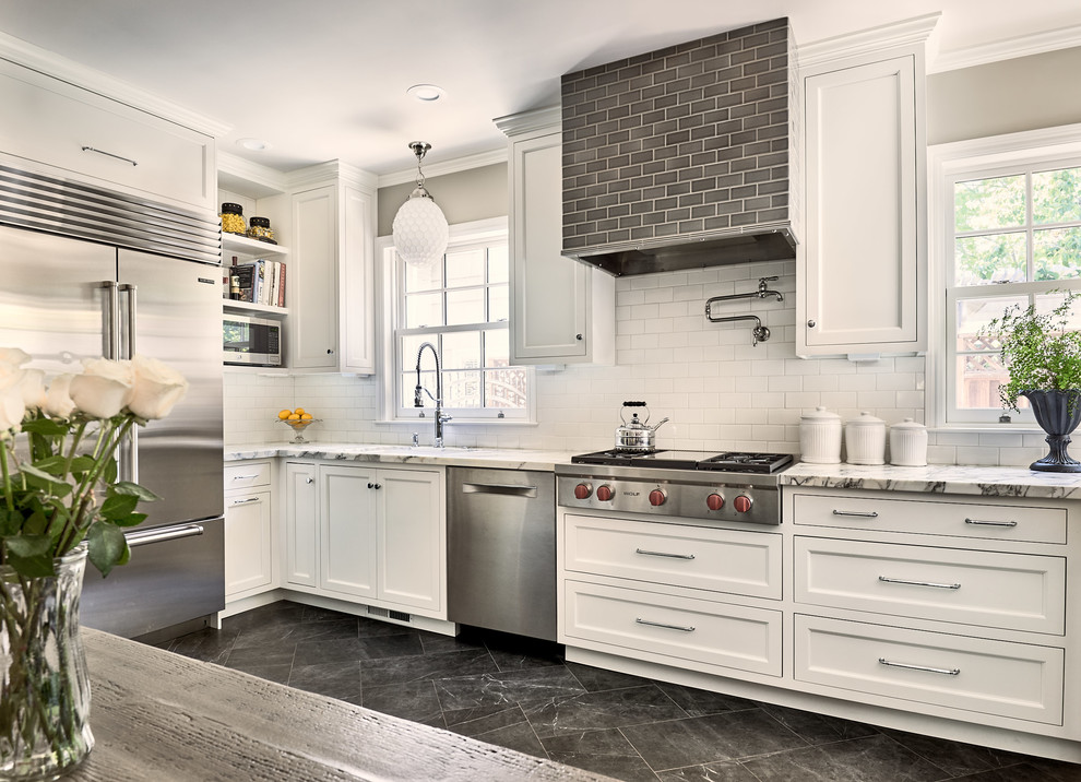 Small modern l-shaped eat-in kitchen in San Francisco with recessed-panel cabinets, white cabinets, marble benchtops, white splashback, porcelain splashback, stainless steel appliances, ceramic floors, no island, grey floor and white benchtop.