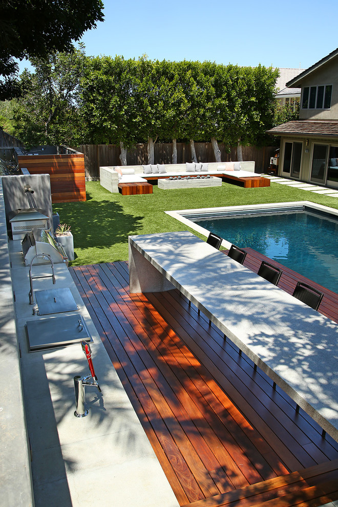 Inspiration for a large contemporary pool in Orange County.