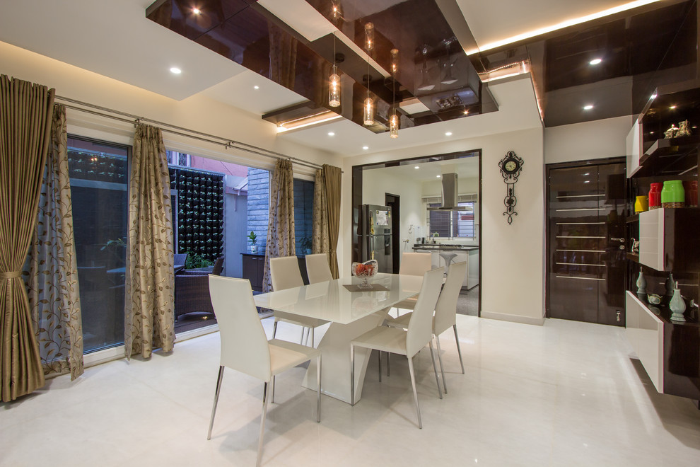 Inspiration for a contemporary dining room in Bengaluru.