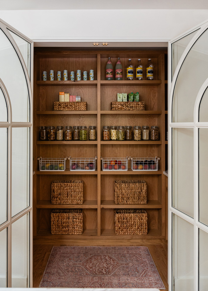 Inspiration for a mid-sized transitional l-shaped light wood floor eat-in kitchen remodel in Chicago with an undermount sink, shaker cabinets, light wood cabinets, marble countertops, white backsplash, marble backsplash, paneled appliances, an island and white countertops
