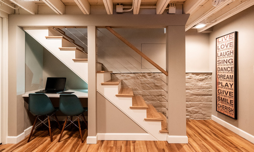 This is an example of a small country look-out basement in Chicago with grey walls, vinyl floors and brown floor.