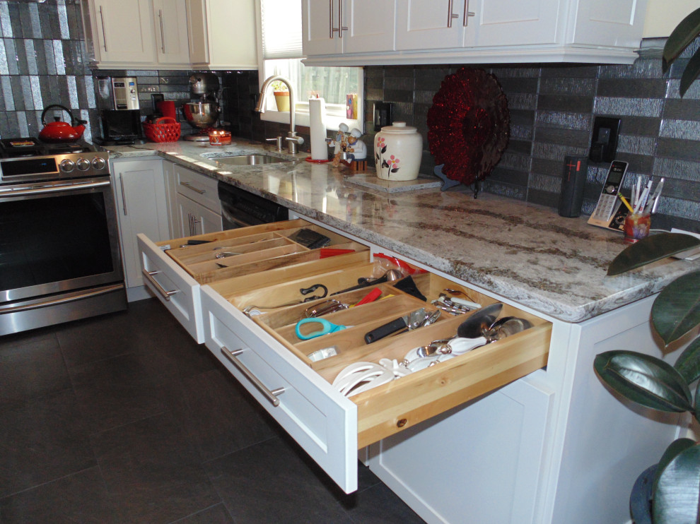 Eat-in kitchen - small transitional l-shaped ceramic tile and brown floor eat-in kitchen idea with an undermount sink, recessed-panel cabinets, white cabinets, quartz countertops, gray backsplash, subway tile backsplash, stainless steel appliances, an island and gray countertops