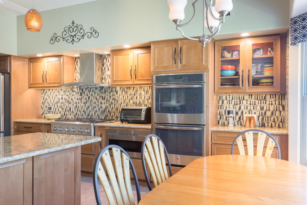 Open concept kitchen - mid-sized contemporary u-shaped porcelain tile open concept kitchen idea with an undermount sink, recessed-panel cabinets, light wood cabinets, granite countertops, multicolored backsplash, glass tile backsplash, stainless steel appliances and an island