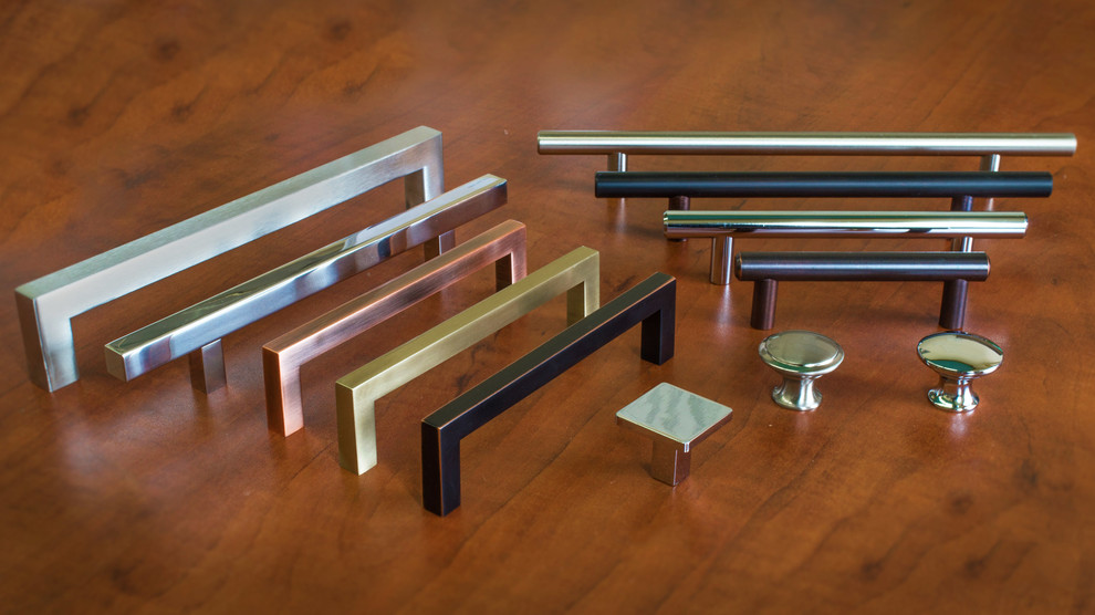 Example of a chrome minimalist metal kitchen design in New York