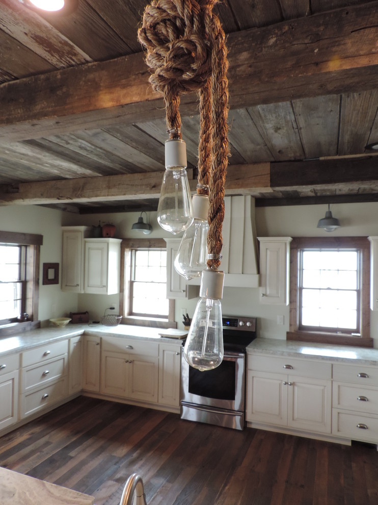 Eat-in kitchen - large rustic u-shaped dark wood floor eat-in kitchen idea with raised-panel cabinets, white cabinets, marble countertops, stainless steel appliances and an island