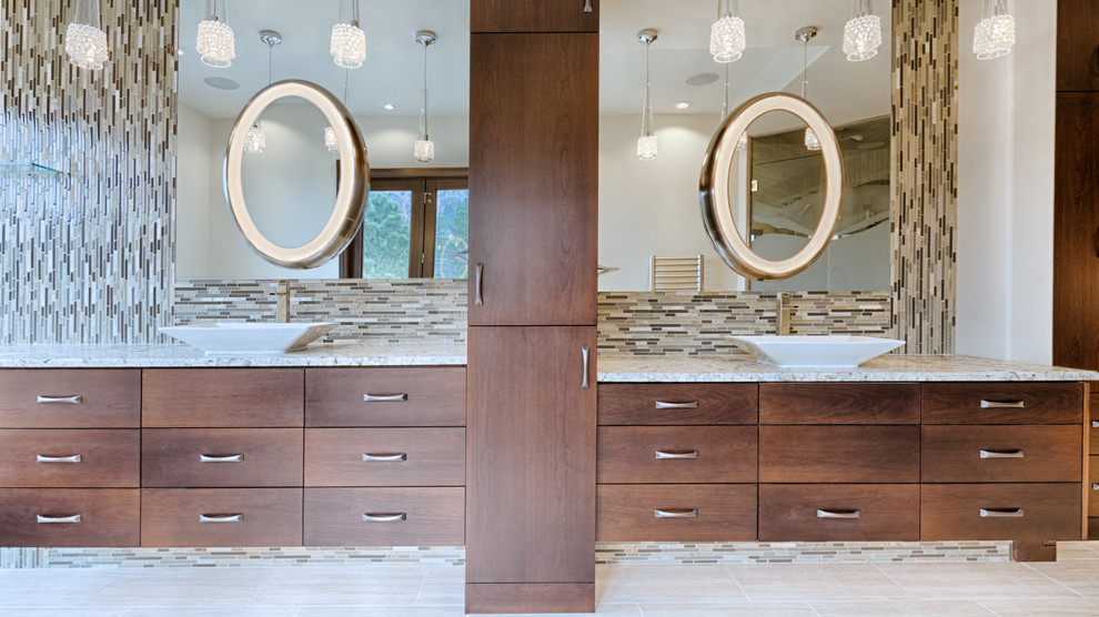 Expansive contemporary master bathroom in Denver with flat-panel cabinets, brown cabinets, a freestanding tub, an alcove shower, beige tile, beige walls, ceramic floors, a vessel sink and granite benchtops.