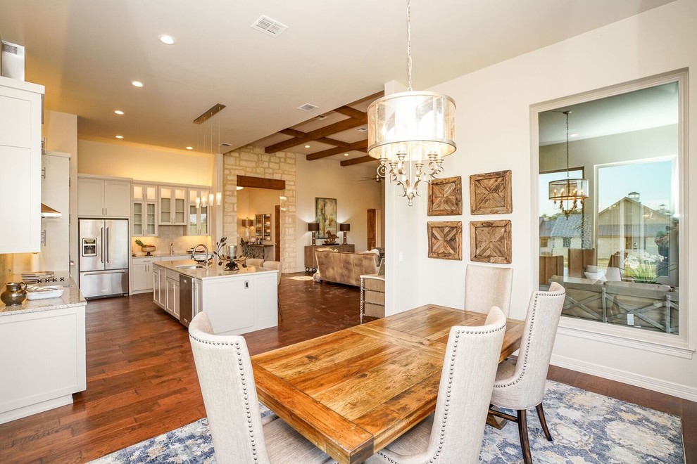 Large contemporary kitchen/dining combo in Austin with white walls, medium hardwood floors and no fireplace.
