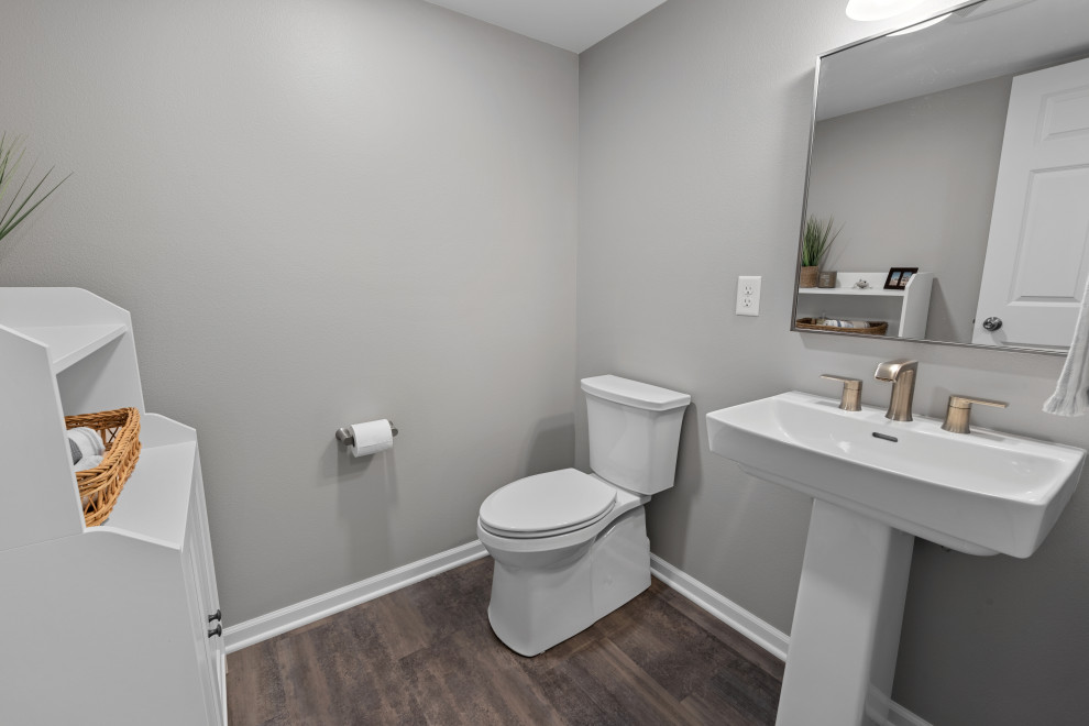 Inspiration for a mid-sized transitional underground vinyl floor basement remodel in Milwaukee