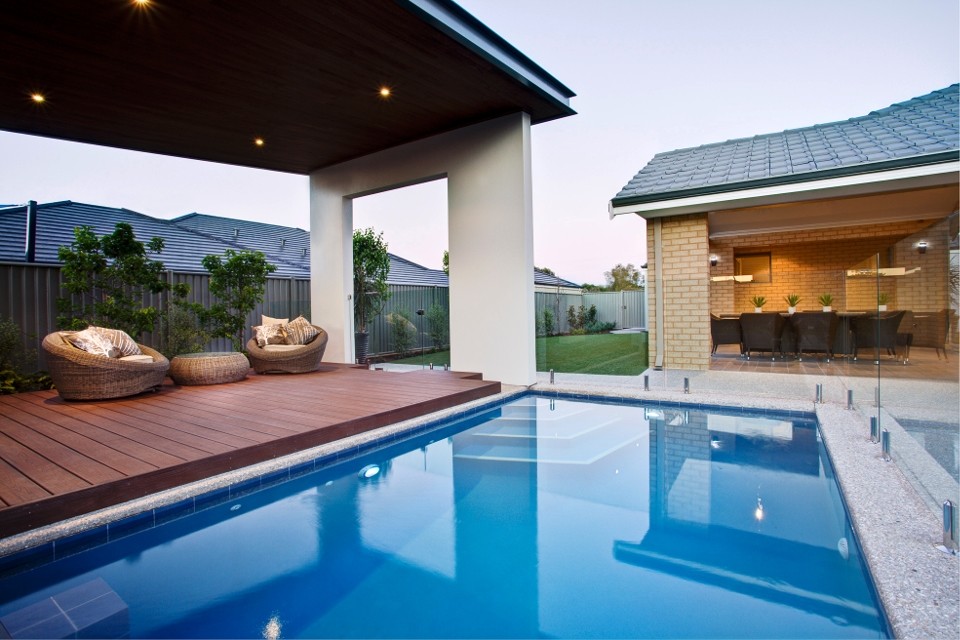 Photo of a mid-sized contemporary backyard deck in Perth with a water feature and a pergola.