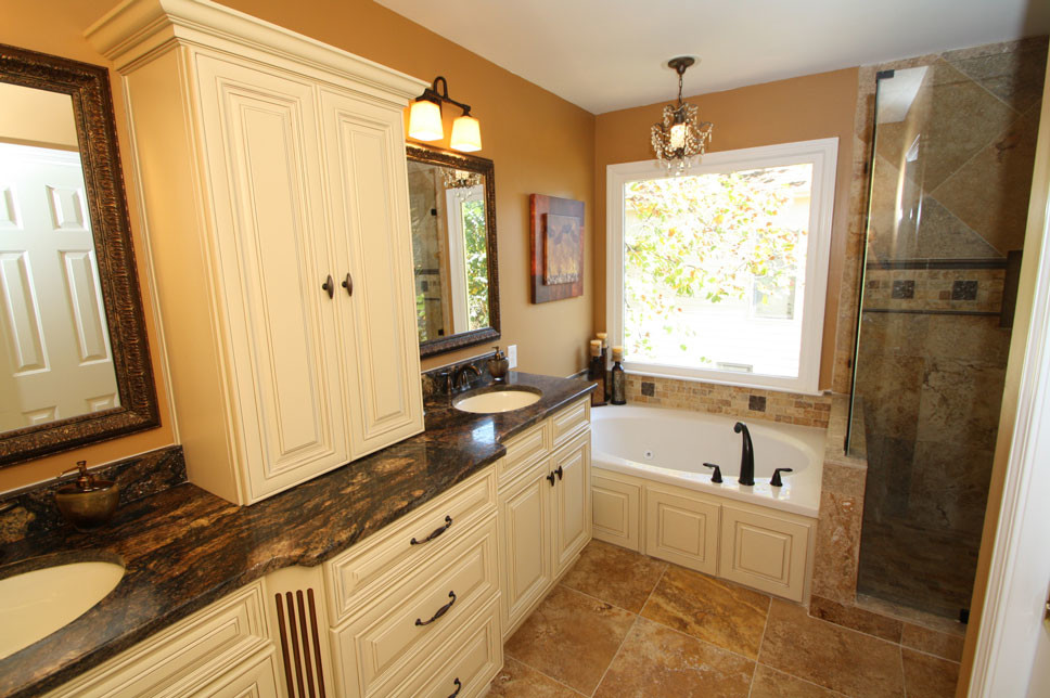 Inspiration for a large traditional master bathroom in Atlanta with shaker cabinets, dark wood cabinets, an alcove shower, beige tile, stone tile, white walls, ceramic floors, an undermount sink and granite benchtops.