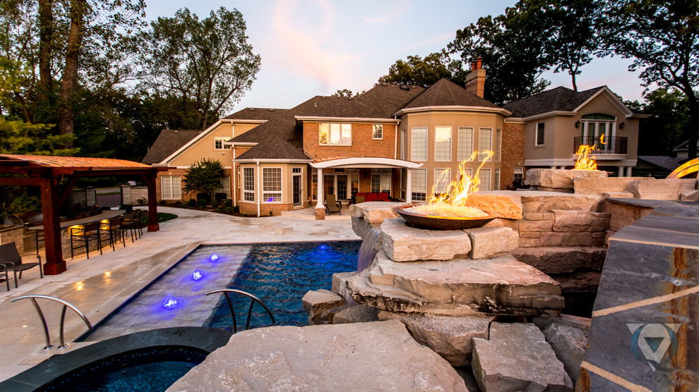 Pool fountain - large rustic backyard stone and rectangular natural pool fountain idea in Chicago