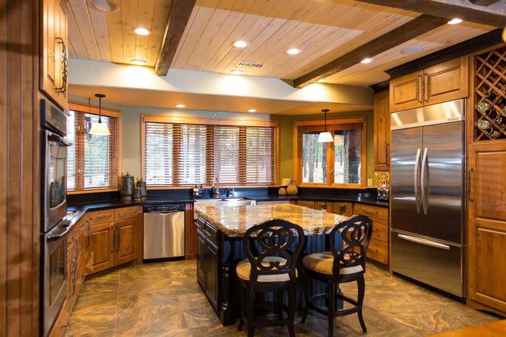 Mid-sized mountain style u-shaped porcelain tile open concept kitchen photo in Phoenix with a farmhouse sink, furniture-like cabinets, medium tone wood cabinets, quartz countertops, multicolored backsplash, mosaic tile backsplash, stainless steel appliances, green walls and an island