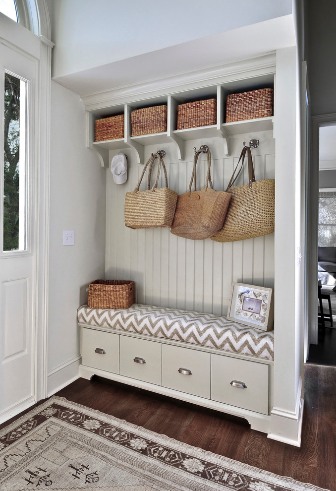 This is an example of a mid-sized beach style mudroom in Charleston.