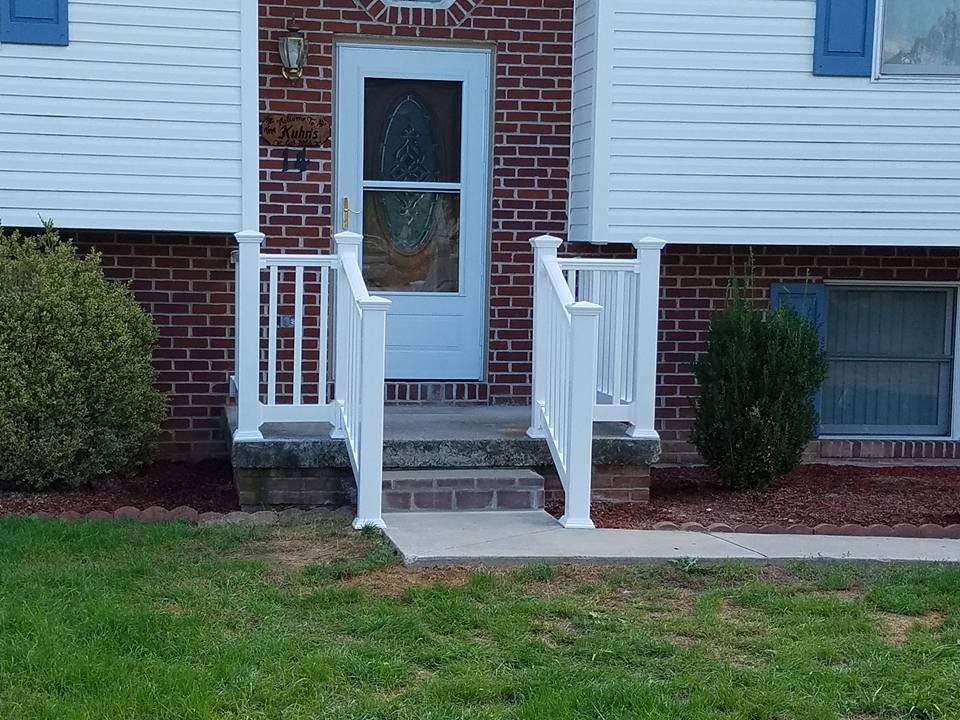 Photo of a small traditional front yard verandah in Philadelphia with concrete slab.