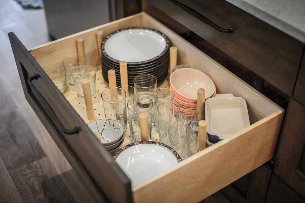 Home design - large transitional galley light wood floor home design idea in Jacksonville with a double-bowl sink, shaker cabinets, dark wood cabinets, quartz countertops, brown backsplash, ceramic backsplash, stainless steel appliances and two islands