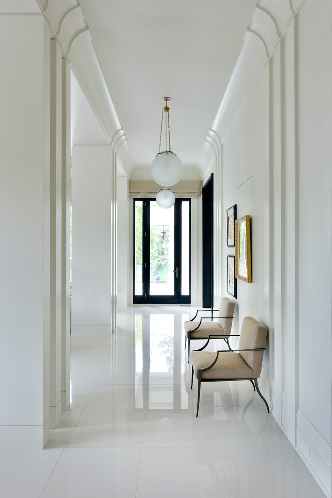 Mid-sized transitional hallway in Toronto with white walls, porcelain floors and white floor.