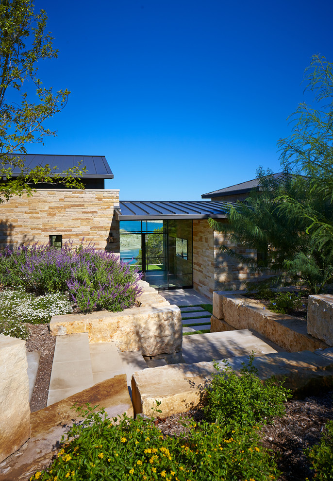 Photo of a contemporary front door in Austin with a single front door and a glass front door.