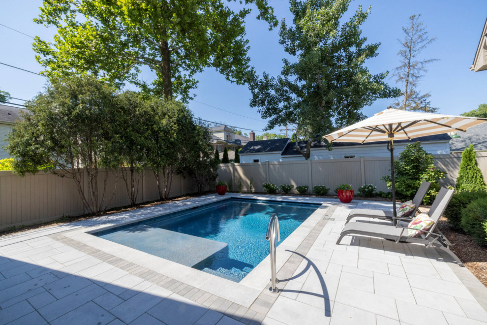 Inspiration for a small timeless backyard stone and rectangular pool house remodel in Chicago