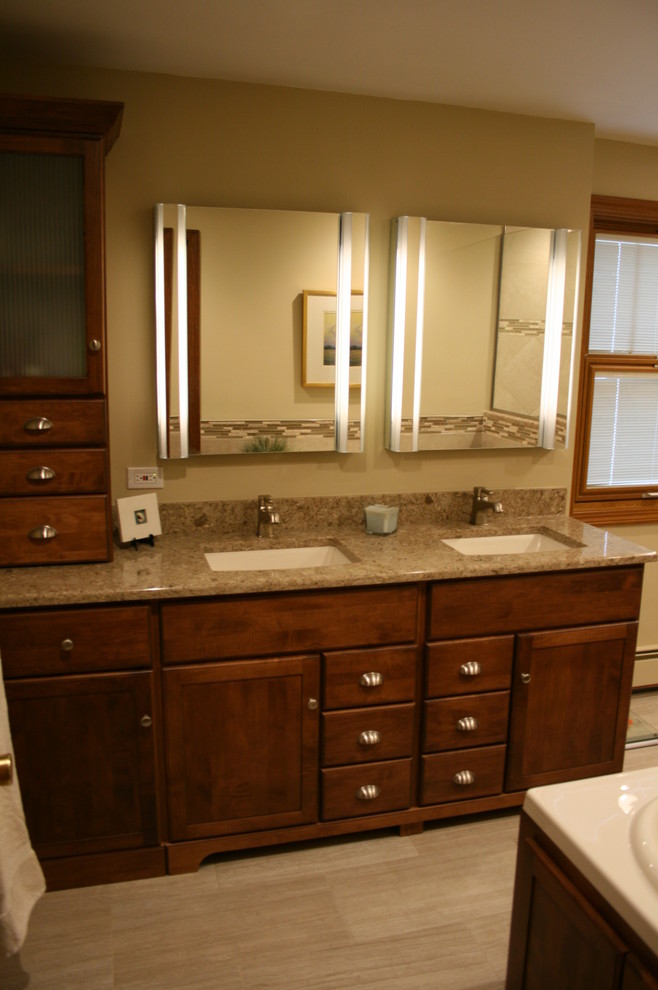 Mid-sized transitional master beige tile and porcelain tile porcelain tile drop-in bathtub photo in Chicago with flat-panel cabinets, brown cabinets, a one-piece toilet, beige walls, an undermount sink and quartz countertops