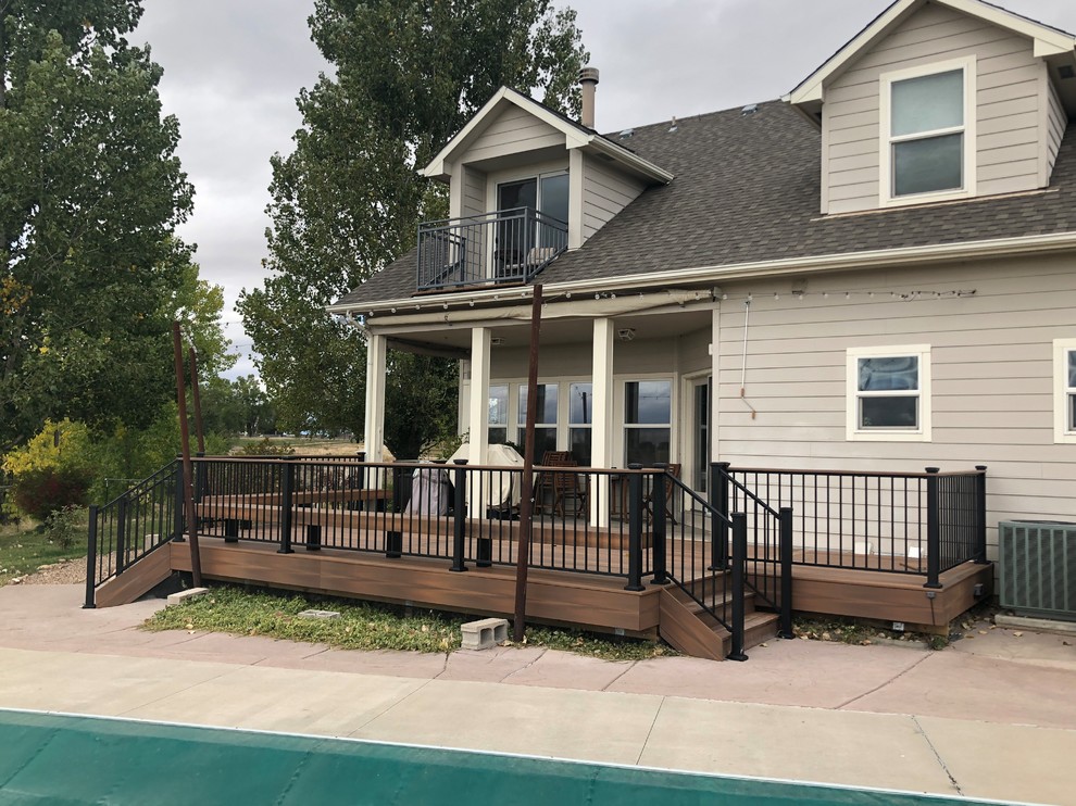 Mid-sized traditional backyard deck in Denver with no cover.