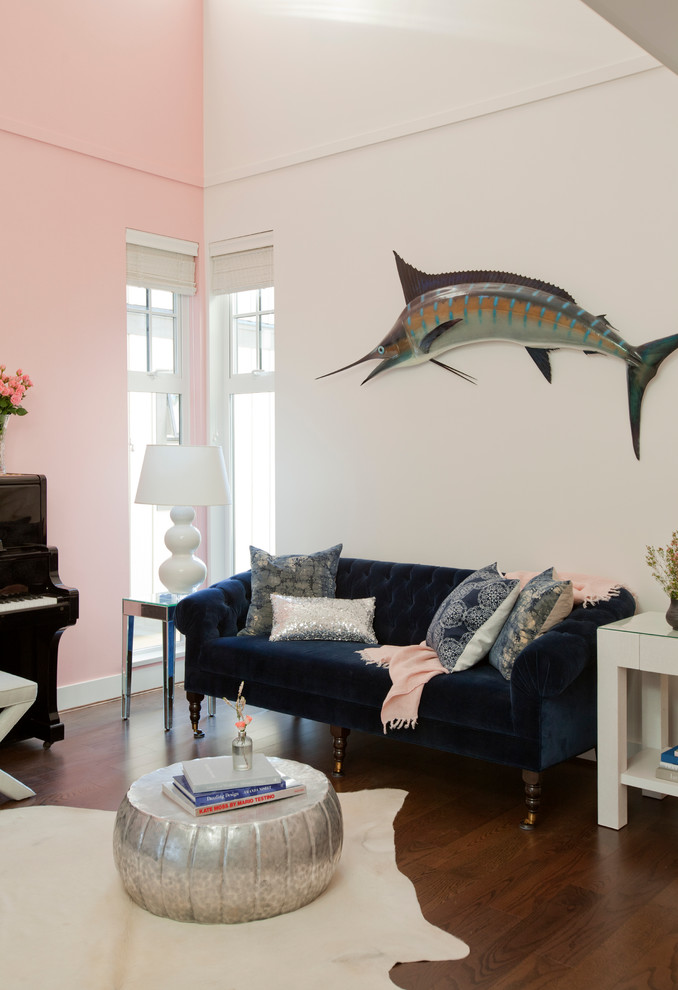 This is an example of an eclectic living room in Vancouver with a music area, pink walls and dark hardwood floors.