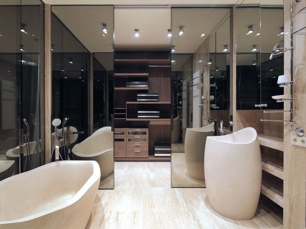 This is an example of a gender-neutral walk-in wardrobe in Moscow with flat-panel cabinets and medium wood cabinets.