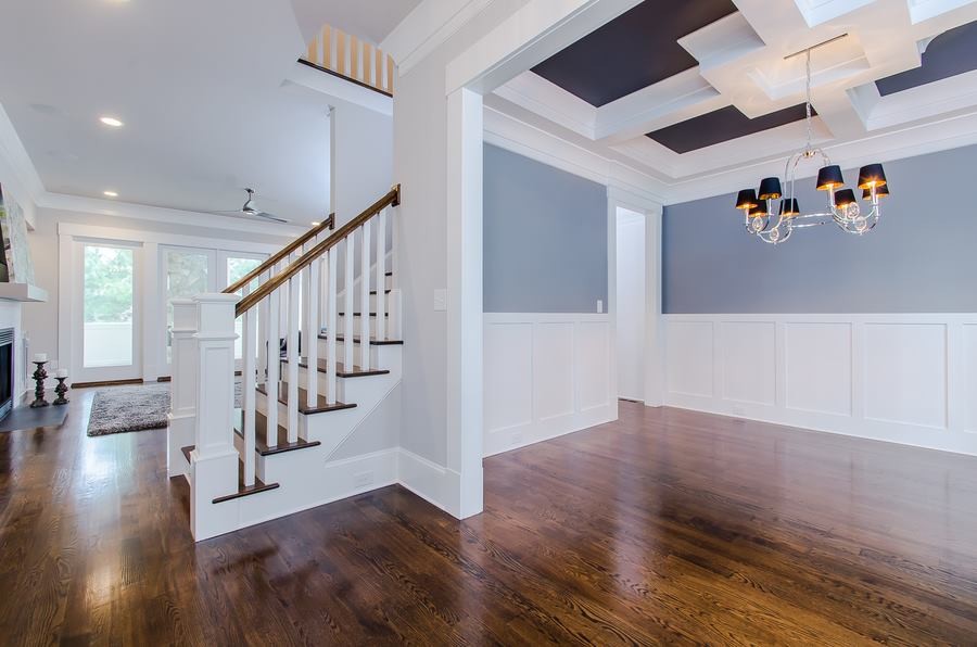 Mid-sized transitional dark wood floor and brown floor front door photo in Raleigh with blue walls