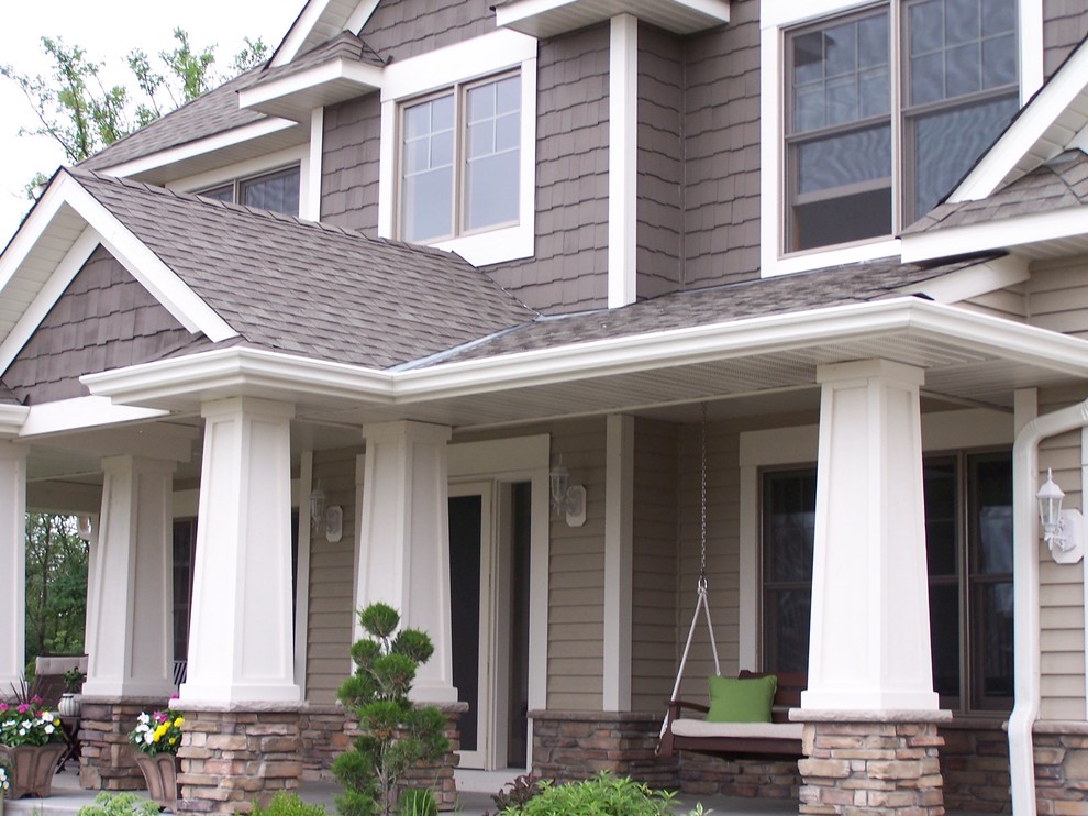 Large modern beige two-story vinyl exterior home idea in Minneapolis
