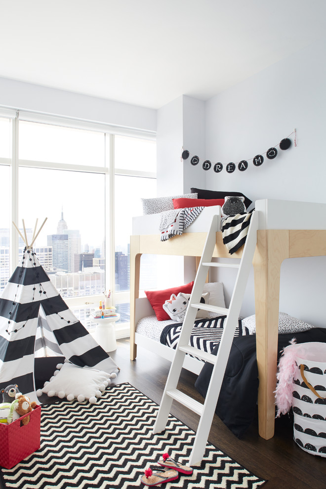 Inspiration for a contemporary kids' bedroom for kids 4-10 years old and girls in Other with grey walls and dark hardwood floors.