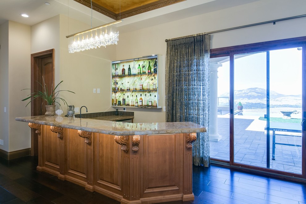 Photo of a large mediterranean single-wall wet bar in San Francisco with an undermount sink, open cabinets, soapstone benchtops and dark hardwood floors.