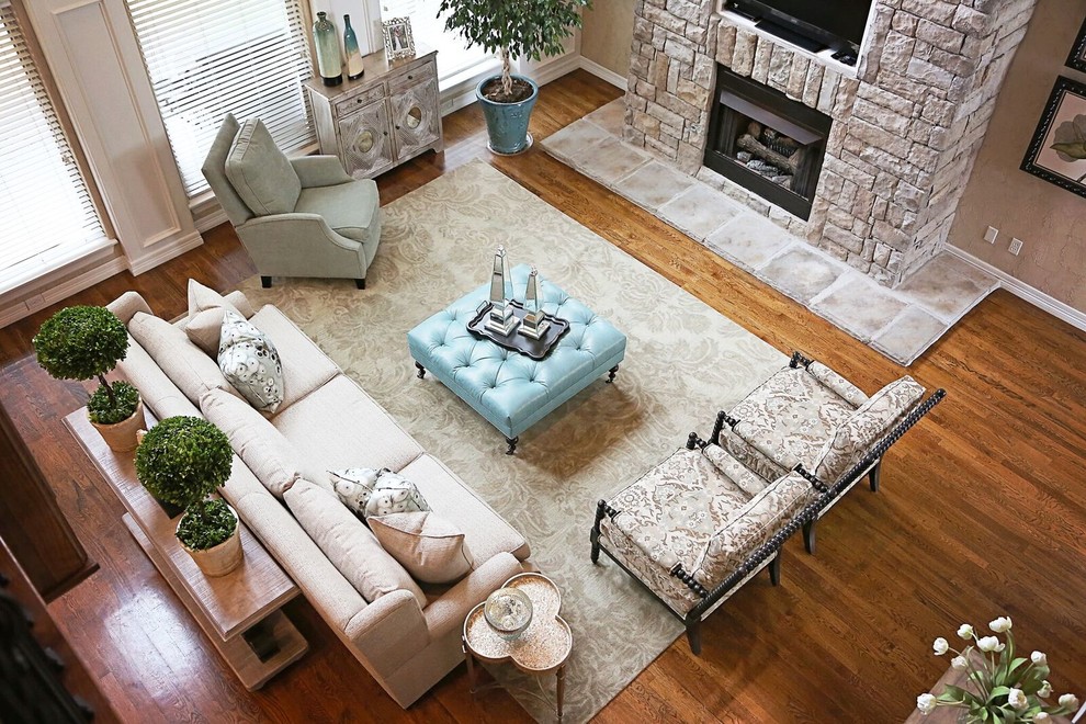 Design ideas for a large transitional living room in Other with light hardwood floors, a stone fireplace surround and a built-in media wall.