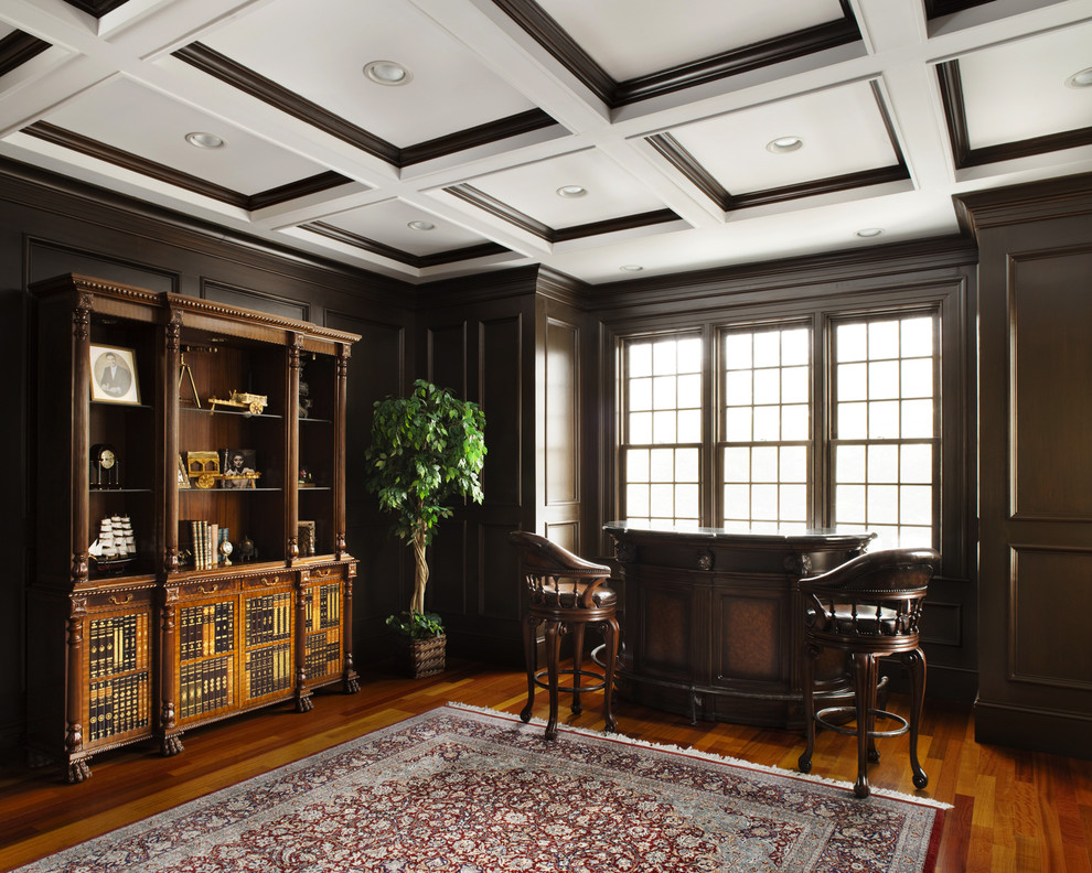 This is an example of a traditional home office in New York with medium hardwood floors.