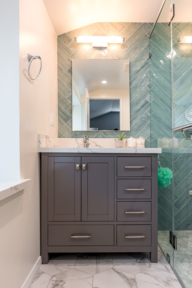 This is an example of a mid-sized beach style 3/4 bathroom in Los Angeles with shaker cabinets, grey cabinets, a corner shower, a one-piece toilet, subway tile, white walls, marble floors, an undermount sink, engineered quartz benchtops, white floor, a hinged shower door, white benchtops, a niche, a single vanity, a freestanding vanity, white tile, wallpaper and wallpaper.